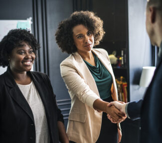 Woman executive shaking hands