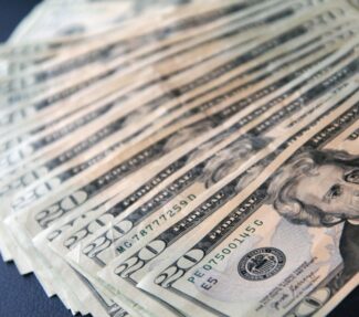 US $20 notes spread on a table