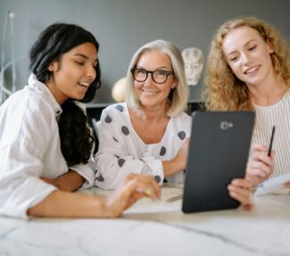 Three women colleagues of different ages and backgrounds