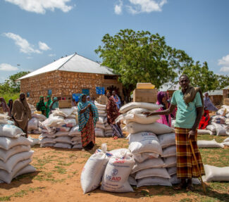 Sacks of food aid with USAID logo being distributed in Ethiopia