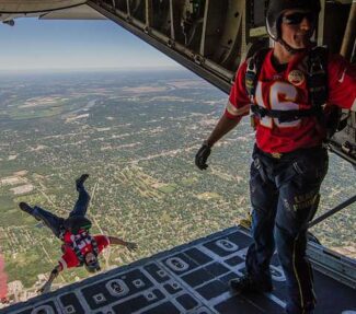 Skydiver leaping from plane