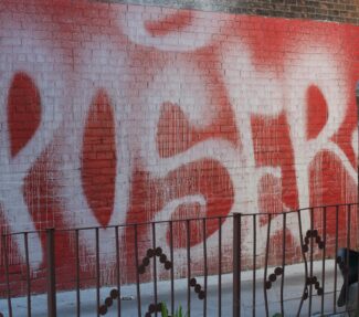 Photo of street art of the word "Poser"