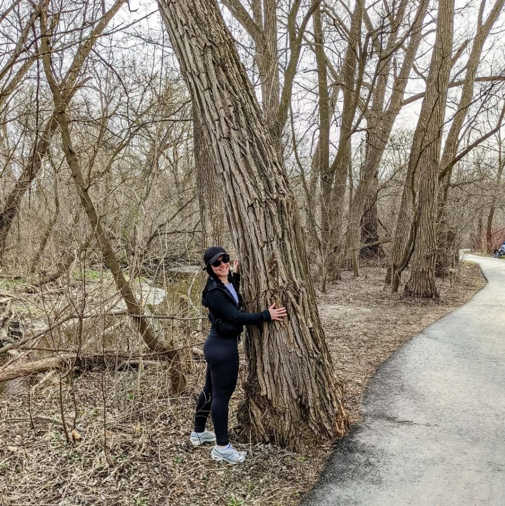 Author Jen Armel with tree in forest
