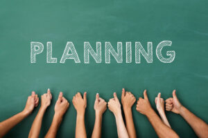 Word "Planning" - with upraised hands