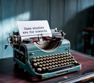 Typewriter with paper with text "Case Studies are for Cowards"