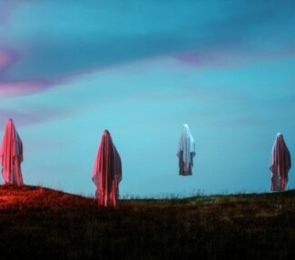 Image of ghosts floating against twilight sky