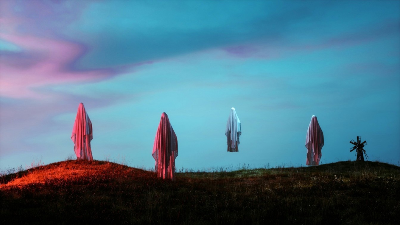 Image of ghosts floating against twilight sky