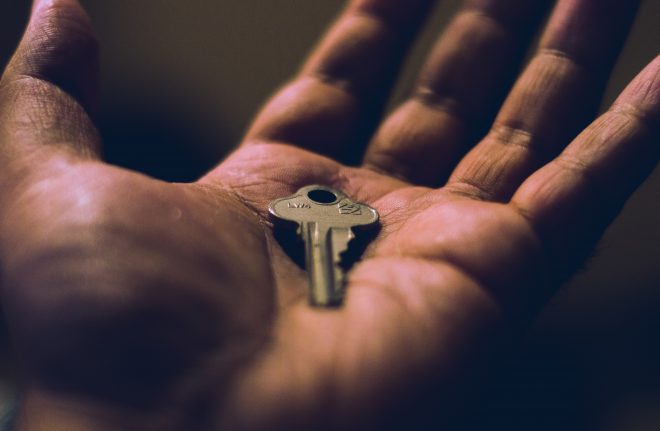 Image of a key in the palm of a hand