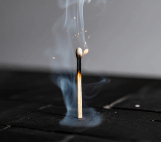 image of a single burned match