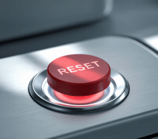 Image of a large red "reset" button