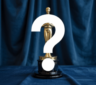 Question mark superimposed on an Oscar-like award trophy against a blue curtain background